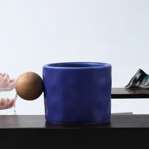 Klein blue ceramic mug with unique wooden ball handle for office and home use, Nordic style.