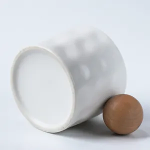 Nordic ceramic coffee mug with wooden ball handle, stylish white office water cup for daily use.