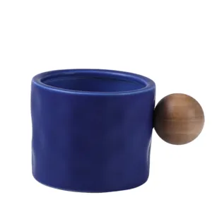 Nordic style Klein blue ceramic coffee mug with unique round wooden ball handle for daily use.