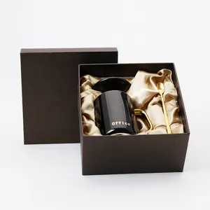 Luxus schwarze Keramik Kaffeetasse Set mit Goldgriff Deckel Löffel in edler Geschenkbox.