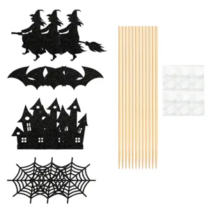 Halloween cake topper detail showing glitter witch, bat and castle cutouts with sticks.