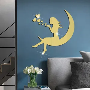 Gold acrylic mirror wall sticker featuring a fairy sitting on a moon blowing lovely hearts.