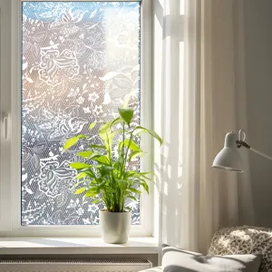 Close-up of white lace window film detail, static cling glass sticker for home decor.