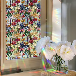 Detailed closeup of stained glass floral window film showing vibrant colors and light refraction.