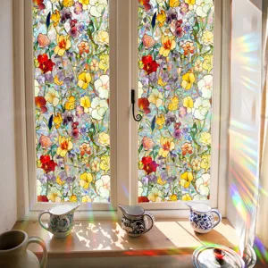 Detailed view of colorful stained glass window film with vibrant floral pattern and light refractions.