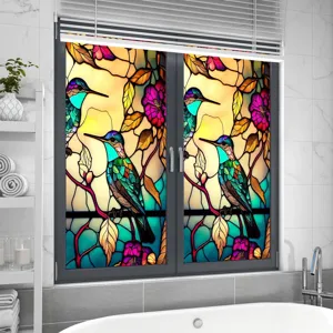 Decorative window film featuring vibrant stained glass hummingbird and floral design for home.