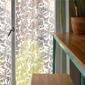 Decorative window film featuring a delicate lace floral pattern, ideal for privacy and home decor.