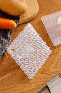Multifunctional cleaning brush detail showing soft resin bristles and flexible design for safe washing.