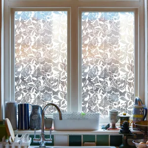 Detailed view of lace static glass window film, decorative privacy film for home kitchen windows.
