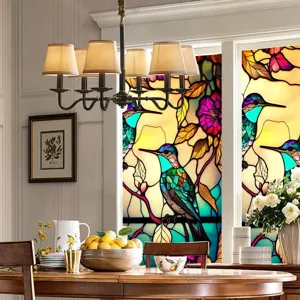 Stained glass window film featuring a colorful retro hummingbird and floral design for home.