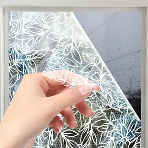 Detailed view of white lace window film showing static cling texture and floral design.