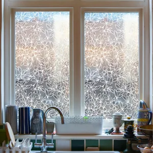 Kitchen window glass sticker scene showing white lace floral frosted privacy film detail.