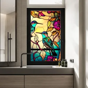 Stained glass window film detail showing vintage hummingbird and floral pattern for home decor.