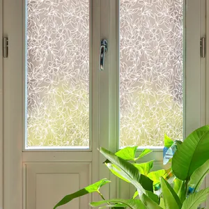 Detailed view of white floral lace window privacy film applied on glass, elegant home decor.