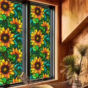 Film pour vitre en verre teinté avec motif de tournesol et de feuilles pour une déco lumineuse.