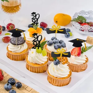 Close-up shot of graduation cake toppers with glitter paper cap and 2024 designs for party decor.