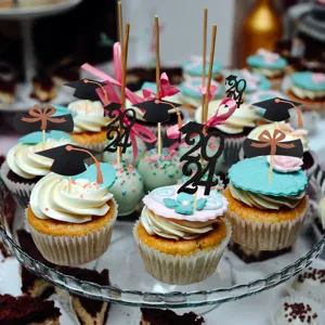 Graduation cupcake toppers featuring black mortarboard hats, bows, and glitter 2024 designs for party decor.