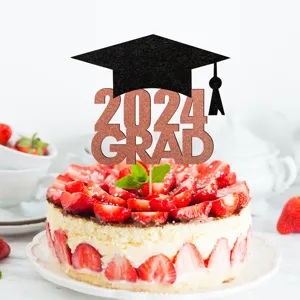 Detailed view of 2024 graduation cake topper, glitter paper grad cap design for party decor.