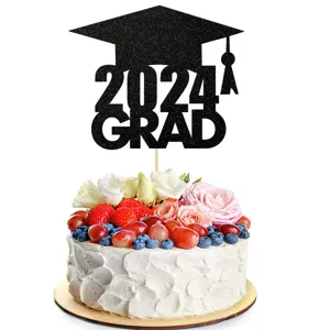 Detailed view of black glitter 2024 graduation cake topper decorated on fresh fruit cake.