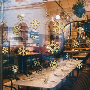 Adesivi murali a specchio con fiocco di neve in acrilico oro per decorazioni natalizie.