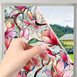 Detailed view of colorful magnolia static window film, decorative glass sticker for home.