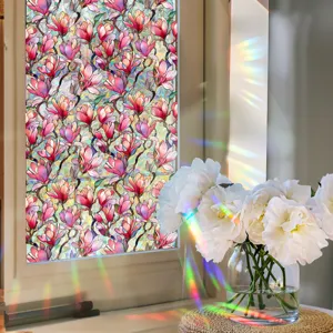 Close-up detail of colorful floral static window film with magnolia pattern and rainbow light.