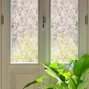 White lace window film detail shot, static cling glass sticker with floral plant pattern.