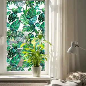 Film pour fenêtre décoratif avec motif de feuilles de monstera tropicales pour maison et bureau.
