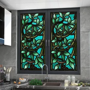 Retro botanical stained glass window film detail showing vibrant green leaves pattern.