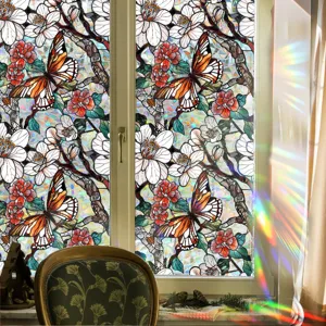 Detailed view of colorful stained glass window film featuring butterfly and floral patterns.