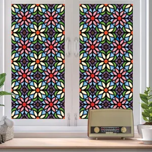 Detailed view of colorful stained glass window film, vintage floral pattern static cling privacy sticker.