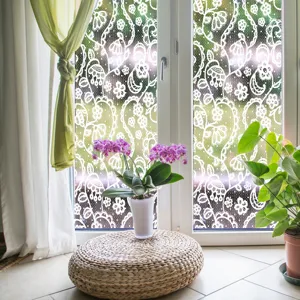 Decorative static window film with elegant white lace pattern for home glass decoration.