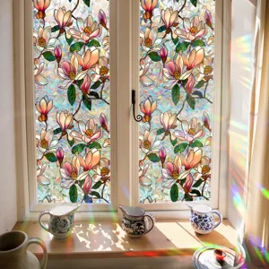 Decorative window film with vibrant floral magnolia design and prism rainbow light effect.