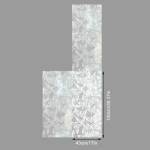 Detail view of static window film with elegant lace butterfly pattern for home decor.