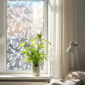Static window film with white butterfly lace pattern, privacy glass sticker for home decor.