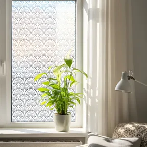 Decorative static window privacy film with elegant scalloped lace gradient pattern for home decor.
