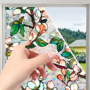 Close-up view of decorative stained glass window film, clearly showing vibrant floral pattern detail.