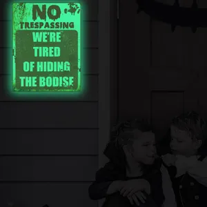 Halloween luminous warning sign wall sticker detail showing bright green glow effect and spooky quote.