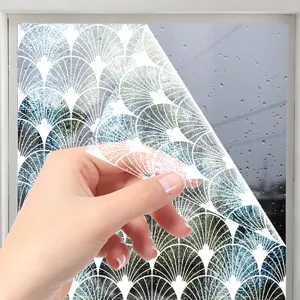 Close-up view of the decorative white lace window film showing geometric pattern details.
