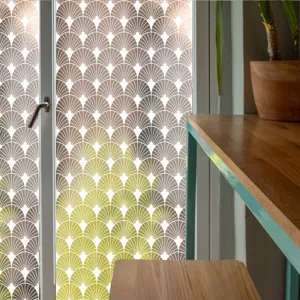 Decorative static window film with elegant fan pattern gradient design for privacy glass home decor.