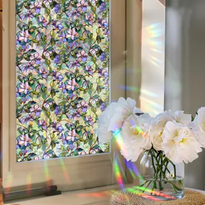 Decorative stained glass window film scene showing colorful floral pattern with rainbow light.
