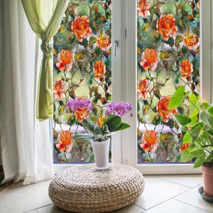 Film de fenêtre décoratif avec des motifs de roses orange élégants pour la décoration intérieure.