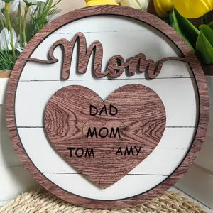 Wooden Mother's Day plaque detail, personalized family names heart puzzle decor for home table.