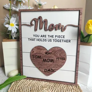 Wooden Mother's Day tabletop decor detail, heart puzzle family name sign for warm gift.