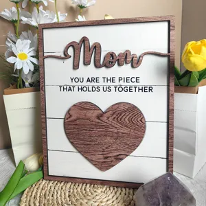 Wooden Mother's Day decorative plaque detail showing the Mom puzzle heart and engraved text.