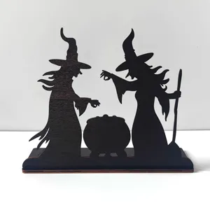 Close-up of wooden Halloween witch silhouette decoration detail showing fine cutout craftsmanship.