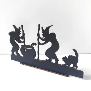 Halloween wooden witch silhouette detail shot, black festival tabletop ornament decor.