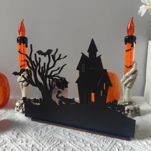 Halloween wooden hollow tabletop decoration detail with haunted house and spooky tree.