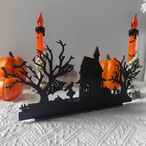 Halloween wooden silhouette table centerpiece with castle pumpkin candle holder decoration.