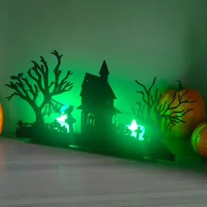 Halloween wooden LED tabletop decoration featuring spooky haunted house and tree silhouette.